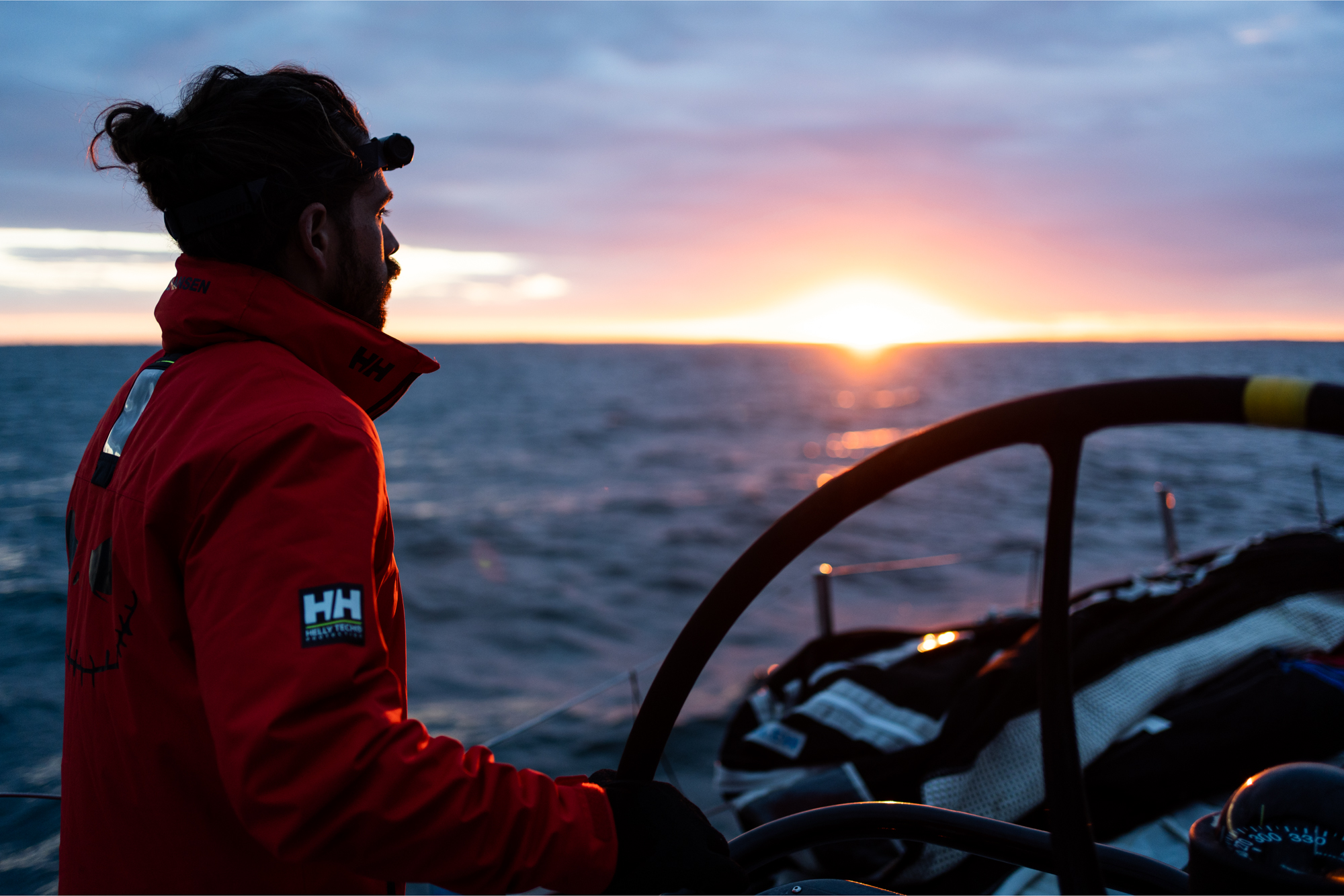 At the helm at sunset